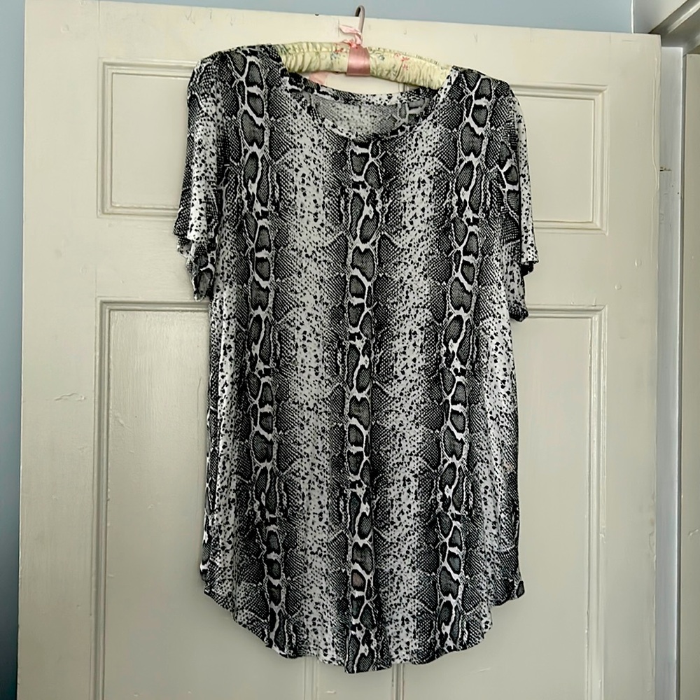 The ladies T-shirt, and black and white animal, print, and size XL